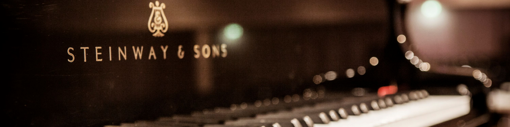 Close-up of a Steinway & Sons grand piano on a stage